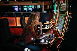 Women gambling on slot machinery